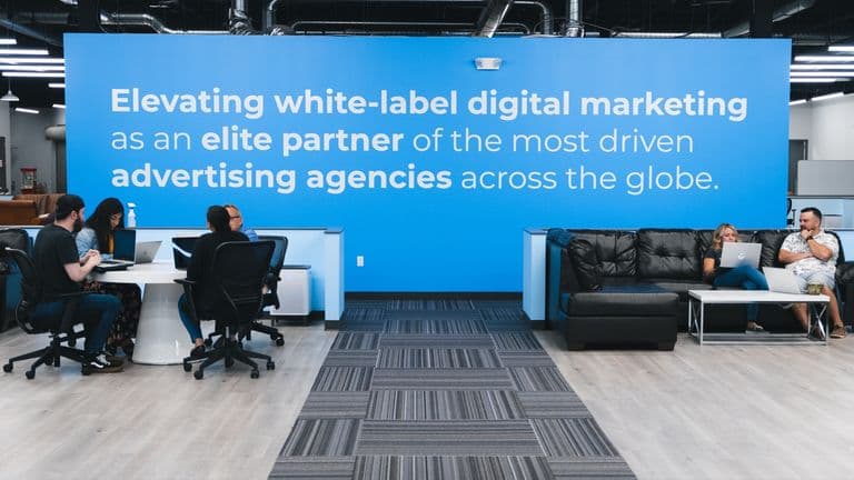 The Conduit office with its brand wall reading Elevating white label digital marketing
