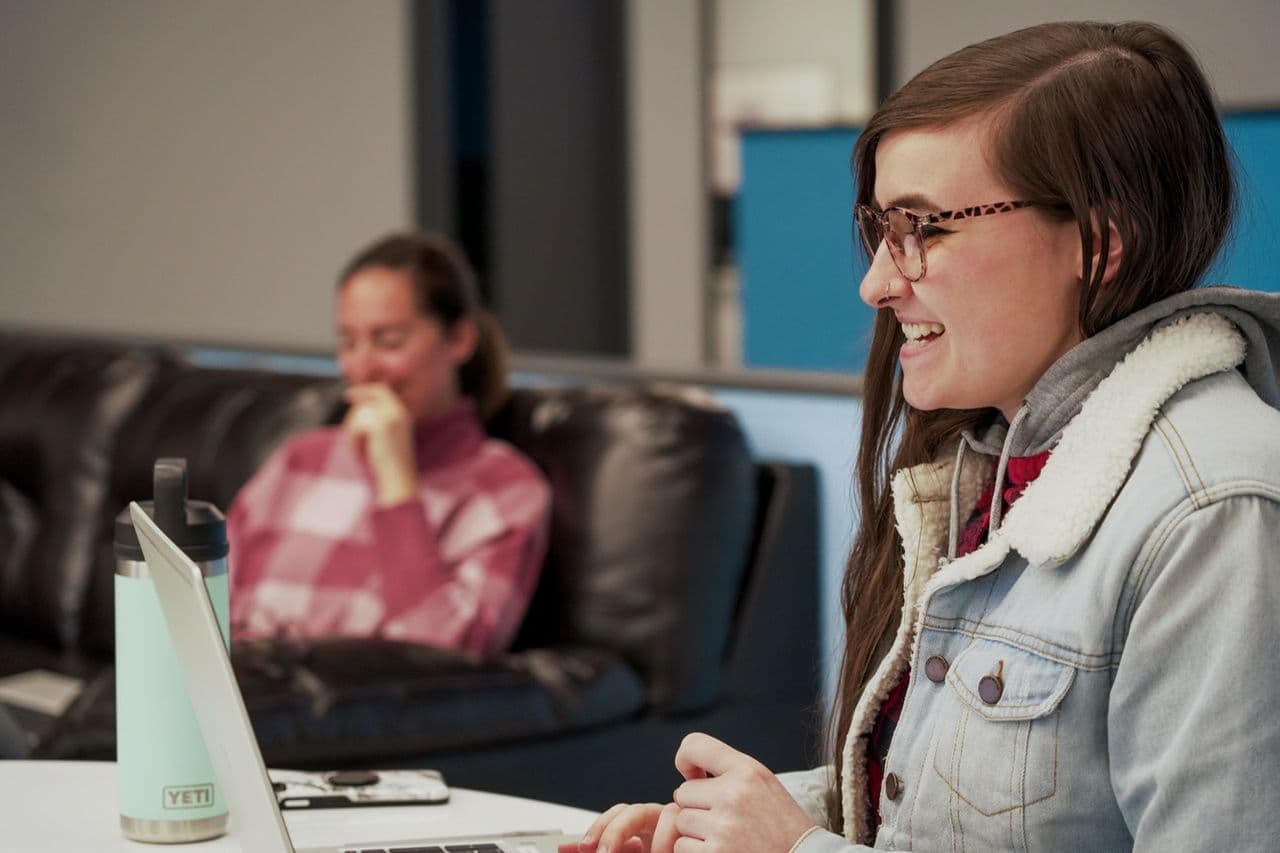 A Conduit team member smiling during a working session