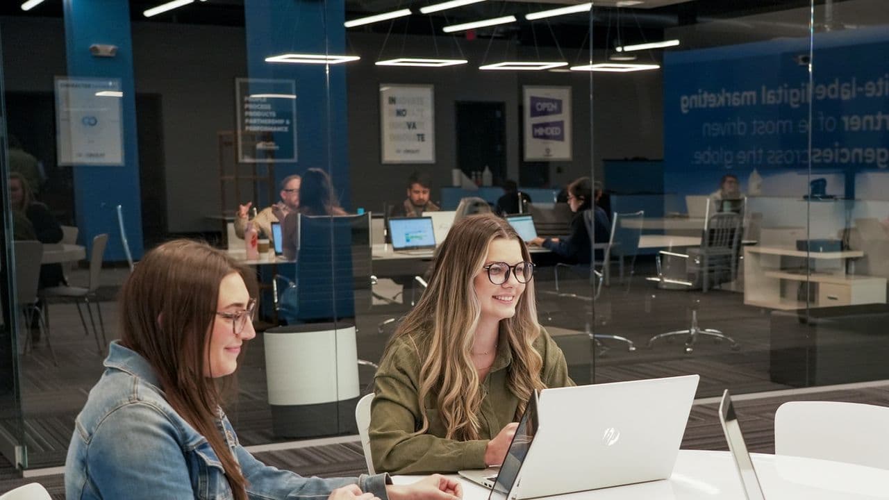 Conduit team members working together in the office