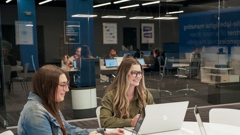 Conduit team members working together in the office