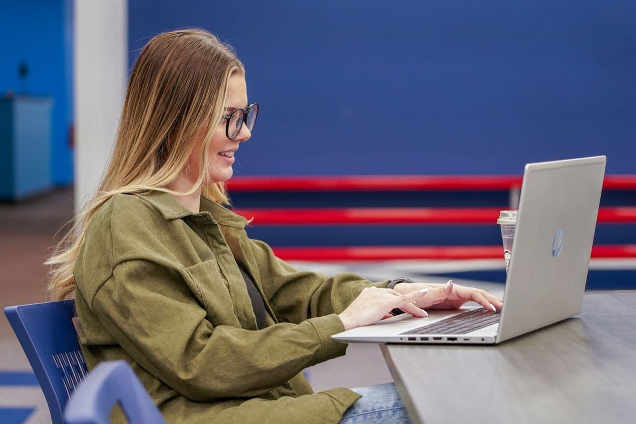 A Conduit analyst focused on campaign work at her laptop