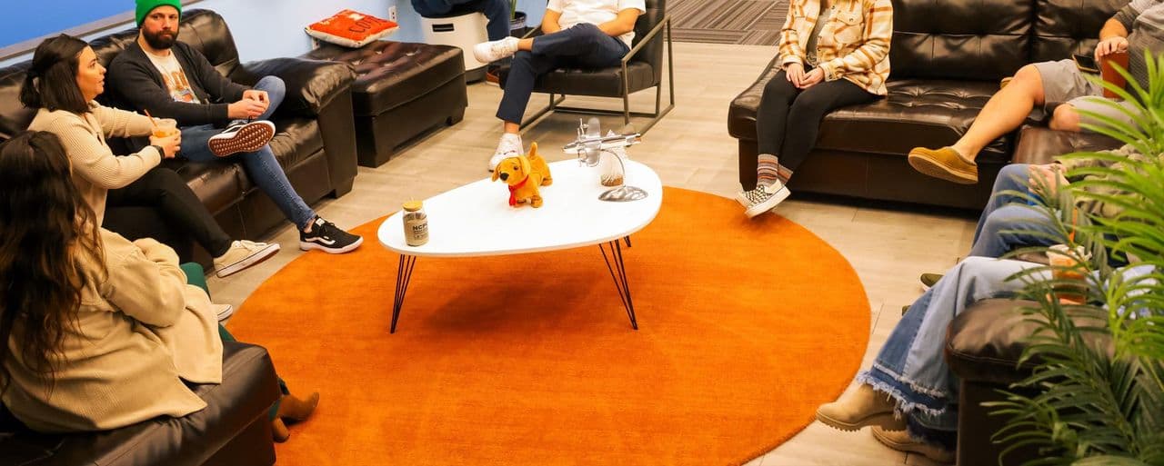 The Conduit team in the office lounge