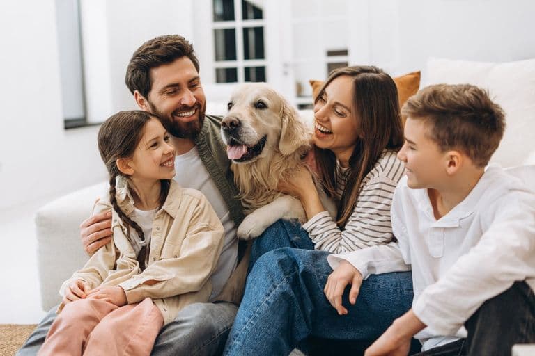 Figo Pet Insurance: a dog at home with its family