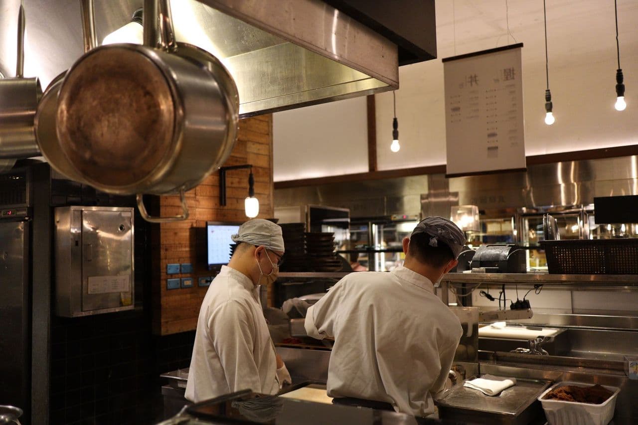 Chefs working the line in a professional restaurant kitchen