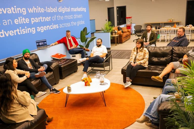 The Conduit team gathered in the office lounge