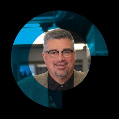 Tim Burke, CEO of Conduit Digital, framed by the Conduit mark